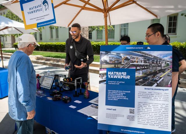 Students at last year’s SpartUp Innovation Showcase showed off their Spartan Superway project at a table on the paseo on campus.